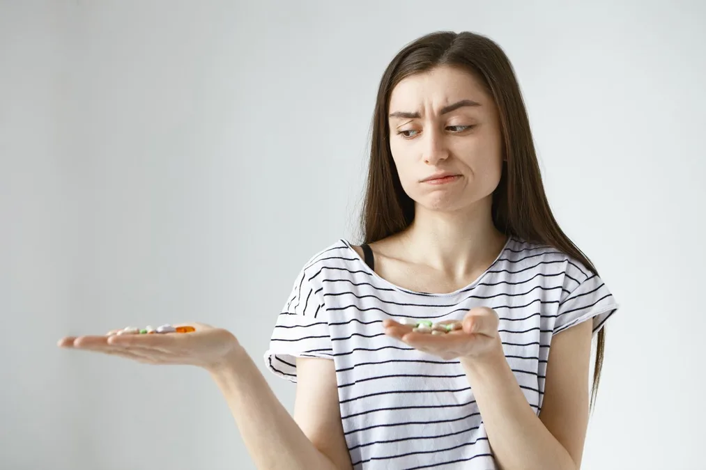 Person reviewing supplements to address vitamin and nutrient deficiencies in Baltimore
