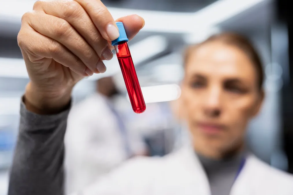 Lab scientist reviewing precision blood testing results at Ideal Wellness in Baltimore